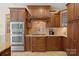 Gourmet kitchen featuring built-in stainless steel appliances, custom cabinetry, and granite countertops at 5016 Woodwinds Ne Dr, Hickory, NC 28601