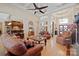 Open-concept living room with hardwood floors, high ceilings, seamless flow to the kitchen and entryway with double doors at 5016 Woodwinds Ne Dr, Hickory, NC 28601