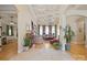 Spacious living room with hardwood floors, tray ceilings, ample seating, and large windows for natural light at 5016 Woodwinds Ne Dr, Hickory, NC 28601