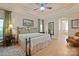 Serene main bedroom featuring tray ceilings, a ceiling fan, and an ensuite bathroom at 5016 Woodwinds Ne Dr, Hickory, NC 28601