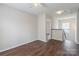 Cozy bedroom with a ceiling fan and wood-look flooring, creating a comfortable and inviting space at 523 Tribune Dr, Charlotte, NC 28214
