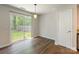 Bright dining area with sliding glass doors leading to the backyard, providing a seamless indoor-outdoor transition at 523 Tribune Dr, Charlotte, NC 28214