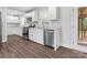 Modern kitchen featuring white cabinets, stainless steel appliances, and granite countertops at 6401 Montpelier Rd, Charlotte, NC 28210