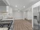 Bright kitchen area with stainless steel appliances and granite countertops, creating a functional space at 6401 Montpelier Rd, Charlotte, NC 28210