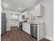 Modern kitchen features stainless steel appliances, white cabinets, and new countertops at 6401 Montpelier Rd, Charlotte, NC 28210