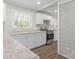 Spacious kitchen featuring stainless steel appliances and white cabinets with granite countertops at 6401 Montpelier Rd, Charlotte, NC 28210