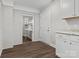 Bright kitchen area boasts white cabinets and granite countertops, providing ample storage and workspace at 6401 Montpelier Rd, Charlotte, NC 28210