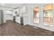 Modern kitchen featuring white cabinets, stainless steel appliances, and granite countertops at 6401 Montpelier Rd, Charlotte, NC 28210