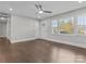 Open living space featuring hardwood floors, a ceiling fan, and seamless design at 6401 Montpelier Rd, Charlotte, NC 28210