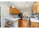 Modern kitchen with stainless steel appliances, marble countertops, and hardwood floors at 6419 Gilead Rd, Huntersville, NC 28078