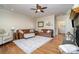 This charming living room offers hardwood floors, comfortable couches and plenty of natural light at 6419 Gilead Rd, Huntersville, NC 28078