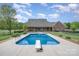 In-ground swimming pool in a beautiful backyard, perfect for outdoor entertaining and relaxation at 6419 Gilead Rd, Huntersville, NC 28078