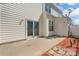 A lovely back patio featuring a sliding glass door and well-maintained landscaping for outdoor relaxation at 643 Brickdust Ct, Fort Mill, SC 29708