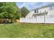 A spacious backyard featuring a well-maintained lawn and privacy fence at 643 Brickdust Ct, Fort Mill, SC 29708