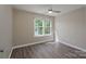 Bright bedroom with a ceiling fan, window, and minimalist design provides a peaceful and inviting ambiance at 643 Brickdust Ct, Fort Mill, SC 29708