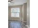 Bright bedroom with a large window, ceiling fan, and neutral decor offers a serene retreat at 643 Brickdust Ct, Fort Mill, SC 29708