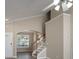 Open-concept living space with a staircase, archway, and plenty of natural light at 643 Brickdust Ct, Fort Mill, SC 29708