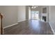 Bright living room featuring hardwood floors, a fireplace, and sliding glass doors to outdoor space at 643 Brickdust Ct, Fort Mill, SC 29708