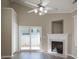 Bright living room featuring hardwood floors, a fireplace, and sliding glass doors to outdoor space at 643 Brickdust Ct, Fort Mill, SC 29708