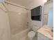 Clean bathroom featuring a shower and tub combination with a blue storage cabinet above the toilet at 6846 Beverly Springs Dr, Charlotte, NC 28270