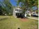 Charming two-story home with a well-manicured lawn, mature trees, and inviting curb appeal at 6846 Beverly Springs Dr, Charlotte, NC 28270