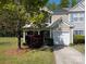 Charming home with an attached garage, a porch, and well-maintained landscaping at 6846 Beverly Springs Dr, Charlotte, NC 28270