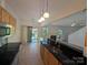 Modern kitchen with stainless appliances, granite counters, and tile backsplash that creates a modern culinary space at 6846 Beverly Springs Dr, Charlotte, NC 28270