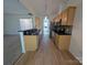Modern kitchen with stainless steel appliances, granite countertops, and breakfast bar, ready for entertaining at 6846 Beverly Springs Dr, Charlotte, NC 28270
