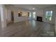 Spacious living room with fireplace, ceiling fan, open layout and easy access to kitchen at 6846 Beverly Springs Dr, Charlotte, NC 28270