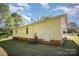 Home's exterior featuring yellow siding, a white door and a lush green yard at 700 Fine Wright Ave, York, SC 29745