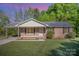 Charming brick ranch home with a covered carport, inviting curb appeal, and landscaped front yard at 700 Fine Wright Ave, York, SC 29745