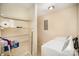 Functional laundry room with shelving provides extra storage space and houses a washer and dryer at 700 Fine Wright Ave, York, SC 29745