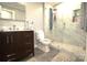 Sleek bathroom with glass shower, marble wall tile, and upgraded fixtures at 7428 Beaufort Cir, Charlotte, NC 28227