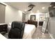 Spacious bedroom with modern ceiling fan, large windows, and marble floors at 7428 Beaufort Cir, Charlotte, NC 28227