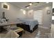 This bedroom has neutral walls, a ceiling fan, and modern décor; creating a comfortable space at 7428 Beaufort Cir, Charlotte, NC 28227