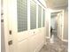 Hallway closet has four doors and provides ample storage with access to other rooms at 7428 Beaufort Cir, Charlotte, NC 28227