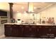 Modern kitchen features granite counters, stainless appliances, and an island cooktop at 7428 Beaufort Cir, Charlotte, NC 28227