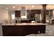 View of the open concept kitchen with stainless steel appliances and granite countertops at 7428 Beaufort Cir, Charlotte, NC 28227