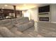 Open-concept living room featuring tile floors, a fireplace and plenty of natural light at 7428 Beaufort Cir, Charlotte, NC 28227