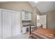 Bedroom featuring closet, built-in desk, and tan walls at 7444 Hurstbourne Green Dr, Charlotte, NC 28277