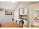 Bedroom features built-in desk, closet, and tan walls at 7444 Hurstbourne Green Dr, Charlotte, NC 28277