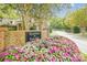 Welcome to Greenhurst at Piper Glen with beautiful landscaping and brick signage at 7444 Hurstbourne Green Dr, Charlotte, NC 28277