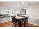 Cozy dining room with modern decor and an adjacent view of the kitchen area at 7444 Hurstbourne Green Dr, Charlotte, NC 28277