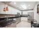 Modern kitchen featuring white cabinets, stainless steel appliances, and updated countertops at 7444 Hurstbourne Green Dr, Charlotte, NC 28277