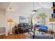 Inviting living room with vaulted ceilings, large windows, and a cozy seating area at 7444 Hurstbourne Green Dr, Charlotte, NC 28277