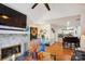 Spacious living area with fireplace, open layout flowing into dining and kitchen areas at 7444 Hurstbourne Green Dr, Charlotte, NC 28277