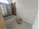 New bathroom featuring a built-in tub ready for finishing, offering comfort and style at 8038 Pawtuckett Rd, Charlotte, NC 28214