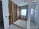 Unfinished bathroom shows plumbing ready for customization with a window for natural light at 8038 Pawtuckett Rd, Charlotte, NC 28214