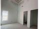 New bedroom design showcases a tall ceiling that has a window perfect for renovation at 8038 Pawtuckett Rd, Charlotte, NC 28214