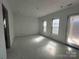Bright unfinished bedroom with windows and a door offers customization for relaxation and comfort at 8038 Pawtuckett Rd, Charlotte, NC 28214